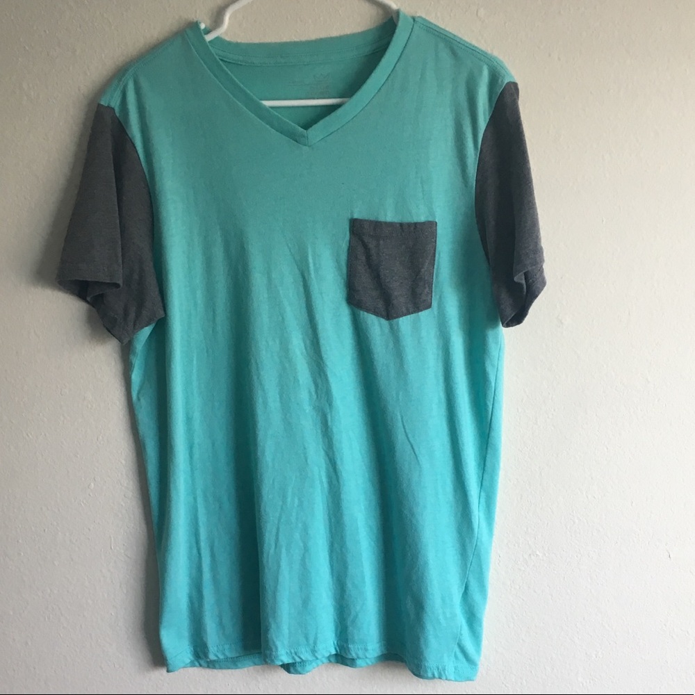 Teal v neck shirt with grey pocket and sleeves